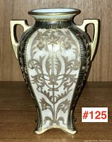 Front view of the antique Nippon porcelain vase showing detailed gold floral designs, square shape, and loop handles.
