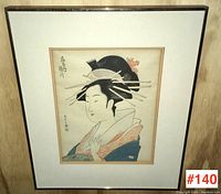 Front view of the framed Japanese woodblock print showing the Geisha portrait in traditional attire and hair style.