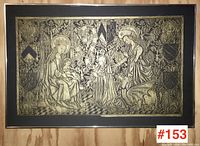 Front view of large framed brass rubbing depicting a religious scene with multiple figures and heraldic shields.