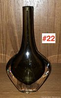Front view of the Orrefors art glass vase showing the shape and smoky brown color with clear base.