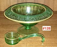 Front and top view of the green Depression glass serving dish with matching ladle, showing ornate raised pattern and gold trim.