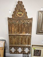 Full view of wooden back piece of Coronation Chair replica showing full height and intricate detailing.