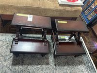 Two step stools side by side showing front view