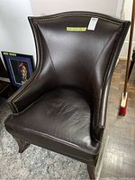 Front angle view showing overall chair shape, curved back and front legs
