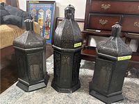 Three lanterns together: tallest in center with two shorter on each side