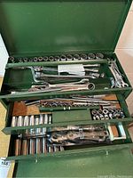 Open toolbox showing three drawers filled with tools, top section visible