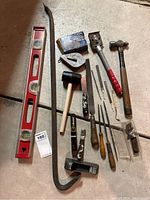 Wide view of group showing all included tools and hardware on a concrete floor