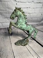 Side angle of the collectible horse statue showing the profile and texture.