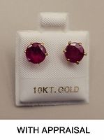 Front view of ruby stud earrings on display card stamped “10KT GOLD”