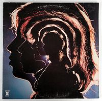 Front cover of album jacket showing artistic layered profiles of band members against dark background.