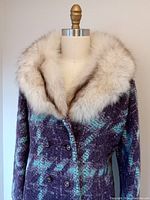 Close-up of front bodice showing wolf fur collar and patterned wool fabric