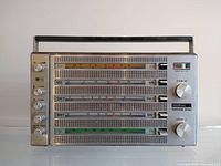 Front view of vintage Nordmende Globetraveler Exec 104 radio showing tuning bands and knobs.