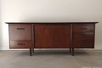 Front view of entire credenza showing three modular units on tapered legs