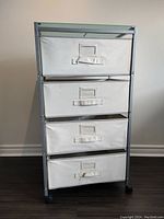 Front view of Ikea rolling four-drawer storage cart with fabric drawers and metal frame.