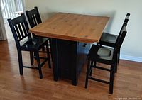 Overall front view of square tabletop and four chairs