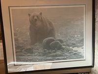 Full view of the framed print showing bear image, mats, frame and reflection in glass