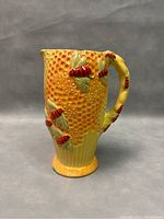 Front and side view of 9-inch Staffordshire Cottage Ware ceramic pitcher with detailed bee and honeycomb relief decorations.