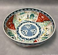 Side interior view showing hand painted alternating panels of landscapes with birds, red floral designs, and green geometric patterns with a central blue circular motif.