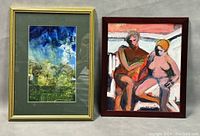 Two framed paintings side by side: watercolour landscape on left and oil on board figures on right.