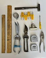 All items laid out clearly displaying the full lot of vintage tools and kitchen items.