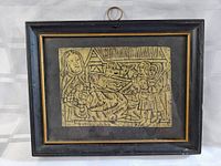 Framed rubbing art showing the entire artwork and frame details.