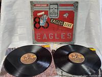 Both vinyl records laid out front side up showing labels and surfaces in good condition.