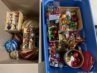 Two bins filled with assorted vintage glass and novelty Christmas ornaments
