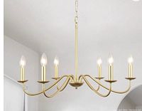 Modern gold finish 6-light chandelier with curved arms and candle-style bulbs