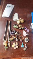 Full assortment of jewelry on wood surface
