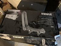 Box of Thule Hull-a-Port Aero folding vertical kayak carrier model 838, showing product image, features, and model number.