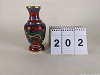 Full front view of the cloisonné vase with numbered display cards to indicate lot number