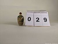Snuff bottle and lot number card
