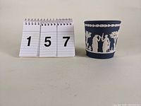 Image showing the size comparison with a numbered display and the Wedgwood jasperware cache pot.