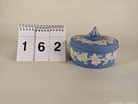 Front view of the jar next to a size reference showing approximate scale.