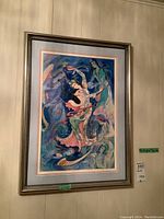 Framed artwork showing full composition on wall.