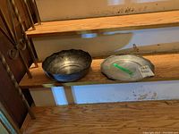 Both bowl and plate side by side on wooden stairs