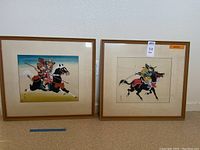 Wide shot of the two framed samurai warrior prints side by side showing their size and framing.