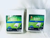 Two sealed 25-pack bundles of Duck brand poly bubble mailers, labeled size #2, front view.