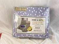 Plastic sealed lavender queen sheet set featuring white spots with Home & Hotel Luxury Comfort branding and extra soft label.