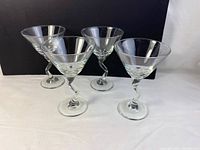 Four Libby Z-stem martini glasses displayed with stems distinctly twisted in a Z shape.