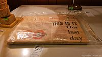 Packaged Toronto Telegram newspaper folded on table with headline visible
