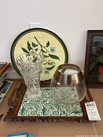 Two serving trays and two vases displayed on a table, showing overall condition and details of patterns.