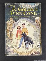 Front cover of The Golden Pinecone first edition dust jacket with colorful fantasy illustration featuring two children, a dog, and mythical creatures.