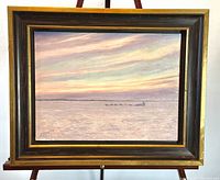 Full view of framed oil painting on easel