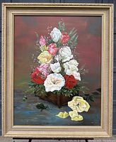 Full view of framed floral oil painting on canvas showing multicolored roses and greenery, signed by the artist.