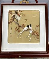 Framed 3-D Chinese artwork with two birds perched on a maple tree branch, signed with Chinese characters.
