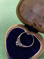 Ring displayed in heart-shaped Siffari box with velvet lining