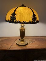 Full view of lamp illuminated on wooden surface