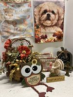 Overview of eight fall and Thanksgiving decorative items with flags, floral basket, wooden signs, turkey figurine, and garland