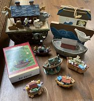 Full lot of Noah's Ark themed items including music box, hanging plaque, small tabletop decor, and six ornaments with one in original box.